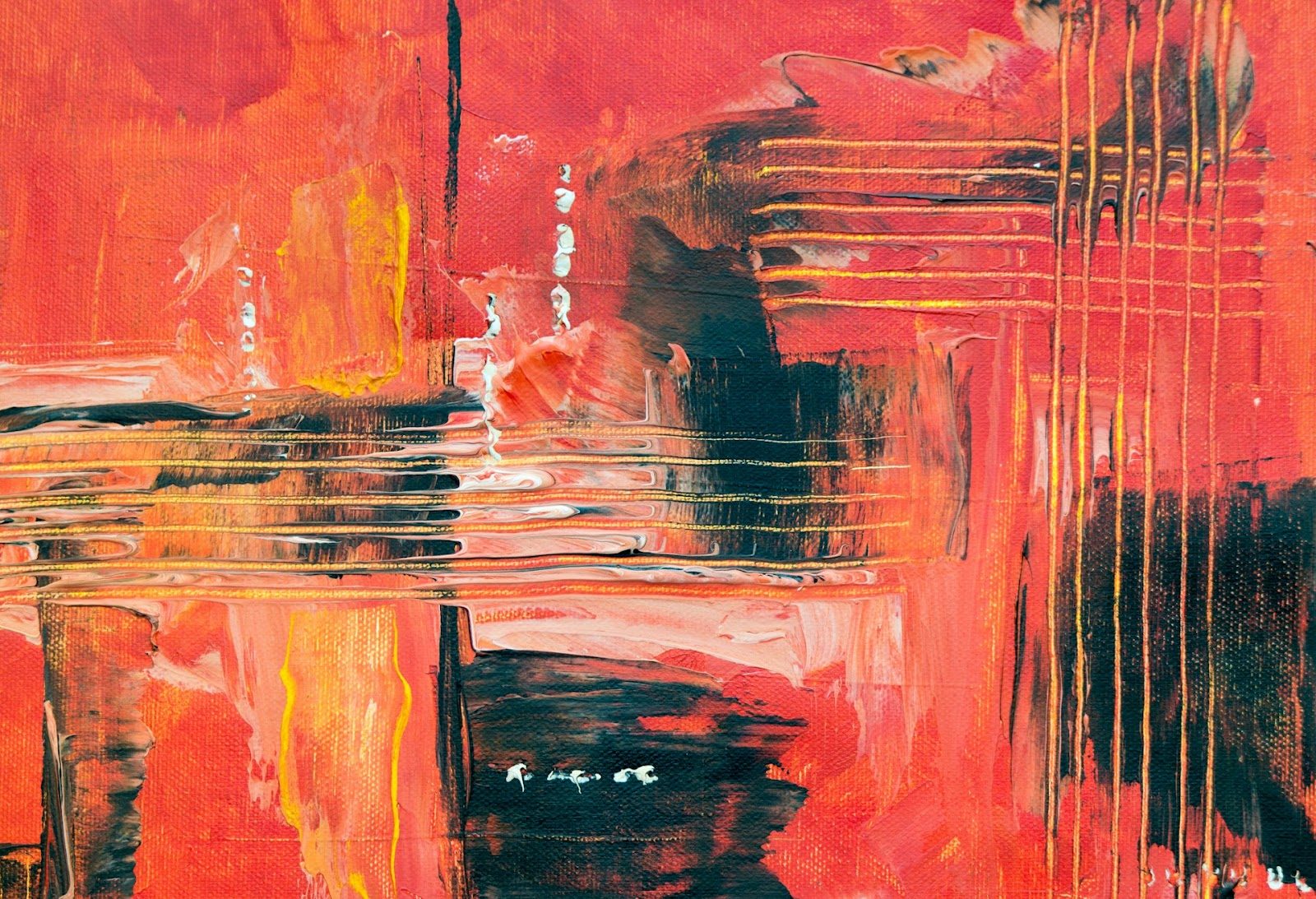 An abstract painting featuring bright red, orange, and black hues, showing a dynamic interplay of colors.